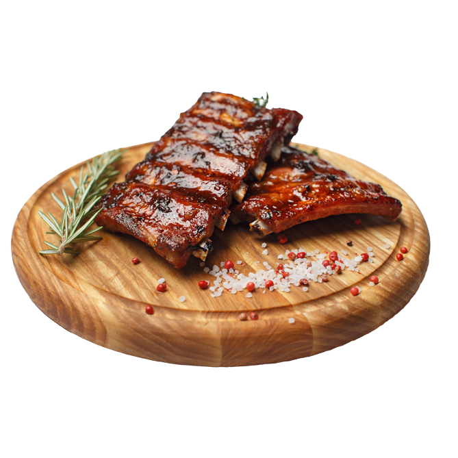 A picture of grilled ribs on a wooden platter